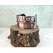 Copper fold formed textured cuff bracelet w/tactile braille "I am enough" in Contracted Braille. Antiqued, burnished, and polished.